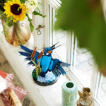 Lego icons Kingfisher playset placed on a window ledger