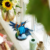 Lego icons Kingfisher playset placed on a window ledger