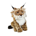 A plush toy resembling a lynx with pointed ears and distinctive coat markings, sitting upright.