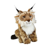 A plush toy resembling a lynx with pointed ears and distinctive coat markings, sitting upright.