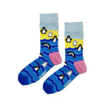 Colorful socks with penguin design on a white background